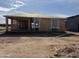 New construction home featuring wood framing, plywood sheeting, and window openings under a blue sky at 4521 S 95Th Dr, Tolleson, AZ 85353
