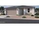 Charming single-story home with a neutral color scheme and a well-manicured front yard at 4521 S 95Th Dr, Tolleson, AZ 85353