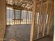 Framing of a room during construction, showcasing stud walls and window framing at 4521 S 95Th Dr, Tolleson, AZ 85353