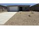 Charming single-story home with a well-maintained front yard and attached garage at 4521 S 95Th Dr, Tolleson, AZ 85353