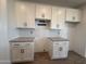 A kitchen with white cabinets, granite countertops, and stainless steel appliances at 4521 S 95Th Dr, Tolleson, AZ 85353