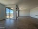 A spacious living room with tile floors and large windows that let in plenty of natural light at 4521 S 95Th Dr, Tolleson, AZ 85353