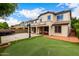 Large backyard featuring a putting green, basketball court, and patio area at 461 W Flamingo Dr, Chandler, AZ 85286