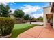 Backyard with a putting green and basketball court, perfect for recreation at 461 W Flamingo Dr, Chandler, AZ 85286