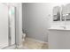 Well-lit bathroom featuring a shower and vanity with ample counter space at 461 W Flamingo Dr, Chandler, AZ 85286