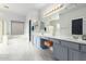 Spacious bathroom boasts double sinks, updated vanity, a tub, and separate glass shower at 461 W Flamingo Dr, Chandler, AZ 85286