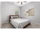Bedroom with a queen bed, plush carpet and bright natural light at 461 W Flamingo Dr, Chandler, AZ 85286