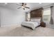Spacious bedroom with decorative wood paneling, ceiling fan and soft carpet at 461 W Flamingo Dr, Chandler, AZ 85286