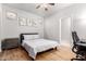 Bright bedroom features wood floors, ceiling fan, and ample natural light at 461 W Flamingo Dr, Chandler, AZ 85286
