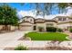 Charming two-story home featuring a well-maintained lawn and three-car garage at 461 W Flamingo Dr, Chandler, AZ 85286