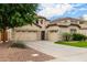 Beautiful home boasts a three-car garage, landscaped front yard, and desert surroundings at 461 W Flamingo Dr, Chandler, AZ 85286