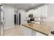 Modern kitchen features granite countertops, white cabinets, and stainless steel appliances at 461 W Flamingo Dr, Chandler, AZ 85286