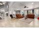 Spacious living room with tile flooring, neutral tones, and a comfortable seating arrangement at 461 W Flamingo Dr, Chandler, AZ 85286
