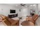 Comfortable living room with tile floors, ceiling fan, and a staircase leading to the upper level at 461 W Flamingo Dr, Chandler, AZ 85286