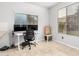 Home office setup with dual monitors and bright, natural light at 461 W Flamingo Dr, Chandler, AZ 85286