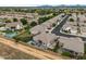 Scenic aerial shot showcasing the property, nearby homes, and desert surroundings at 4960 E Villa Theresa Dr, Scottsdale, AZ 85254