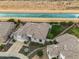 Aerial view of a well-kept home near a desert canal on a sunny day at 4960 E Villa Theresa Dr, Scottsdale, AZ 85254