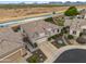 Aerial view of a lovely single-story home with a well-kept yard near a canal at 4960 E Villa Theresa Dr, Scottsdale, AZ 85254
