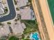 Overhead aerial showcases this home's backyard oasis and surrounding community at 4960 E Villa Theresa Dr, Scottsdale, AZ 85254