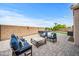Serene backyard featuring an outdoor kitchen, comfortable seating, and lush landscaping at 4960 E Villa Theresa Dr, Scottsdale, AZ 85254