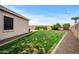 Lush backyard offers a serene retreat with green grass and gravel accents at 4960 E Villa Theresa Dr, Scottsdale, AZ 85254