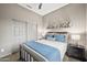 Comfortable bedroom with a queen bed, a ceiling fan, and a closet with mirrored doors at 4960 E Villa Theresa Dr, Scottsdale, AZ 85254