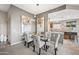 Elegant dining room featuring a glass-top table and stylish upholstered chairs at 4960 E Villa Theresa Dr, Scottsdale, AZ 85254