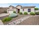 Well-maintained single-story home with desert landscaping and charming curb appeal at 4960 E Villa Theresa Dr, Scottsdale, AZ 85254