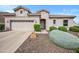 Charming single-story home featuring a well-manicured front yard and a two car garage at 4960 E Villa Theresa Dr, Scottsdale, AZ 85254