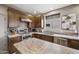 Well-equipped kitchen with granite countertops, stainless steel appliances, and ample cabinet space at 4960 E Villa Theresa Dr, Scottsdale, AZ 85254
