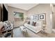 Bright living room featuring a white sofa, stylish decor, and a view of the backyard at 4960 E Villa Theresa Dr, Scottsdale, AZ 85254