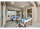 Cozy covered patio with comfortable seating and views of the yard at 4960 E Villa Theresa Dr, Scottsdale, AZ 85254