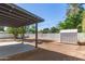 View of the backyard featuring a shed, ample space, mature trees and a covered patio at 510 W 14Th St, Tempe, AZ 85281