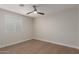 Bedroom featuring wood floors, neutral colored walls, a modern ceiling fan and a window with blinds at 510 W 14Th St, Tempe, AZ 85281