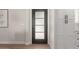 Modern entryway with a stylish door, complemented by white cabinets and light hardwood flooring at 510 W 14Th St, Tempe, AZ 85281