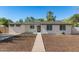 Charming single-story home with a manicured lawn and a welcoming entrance, showcasing its curb appeal at 510 W 14Th St, Tempe, AZ 85281