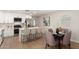 Kitchen featuring stainless appliances, white cabinets, quartz counters, and a center island with barstool seating at 510 W 14Th St, Tempe, AZ 85281