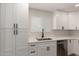 Bright kitchen featuring white cabinets, quartz counters, stainless appliances, and a large sink at 510 W 14Th St, Tempe, AZ 85281