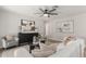 Elegant living room featuring stylish furniture, contemporary art, and a modern ceiling fan for added comfort at 510 W 14Th St, Tempe, AZ 85281