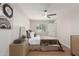 Bedroom features an upholstered headboard, wood-look floors, and a ceiling fan at 510 W 14Th St, Tempe, AZ 85281