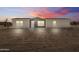 Charming single-story home featuring board and batten siding, and a well-manicured front yard at 52002 W Sotol Rd, Maricopa, AZ 85139