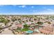 Extensive aerial view of a residential community featuring diverse architecture, mature trees, and neighborhood appeal at 528 E Kyle Ct, Gilbert, AZ 85296