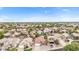 Expansive aerial view of a neighborhood showcasing well-maintained homes and lush landscaping in a suburban setting at 528 E Kyle Ct, Gilbert, AZ 85296