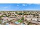 Vast aerial perspective of a neighborhood, displaying a variety of housing styles, green spaces, and community charm at 528 E Kyle Ct, Gilbert, AZ 85296