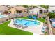 Private backyard pool area with lounge chairs, tropical landscaping, and modern design, creating a resort-like retreat at 528 E Kyle Ct, Gilbert, AZ 85296
