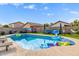 Spacious backyard with a sparkling pool, fun floats, and lounge seating, perfect for outdoor enjoyment at 528 E Kyle Ct, Gilbert, AZ 85296