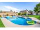 Beautiful backyard pool with plenty of floats, space, seating, and mature landscaping at 528 E Kyle Ct, Gilbert, AZ 85296