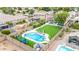 Stunning backyard with a sparkling pool, lush artificial turf, and outdoor seating, perfect for relaxation and entertainment at 528 E Kyle Ct, Gilbert, AZ 85296
