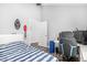 Neat bedroom with a bed, desk, ceiling fan, artwork, and plenty of space for relaxation and study at 528 E Kyle Ct, Gilbert, AZ 85296