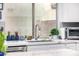 Kitchen sink area with a modern faucet and a view of the outdoors at 528 E Kyle Ct, Gilbert, AZ 85296